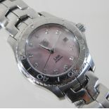 A Tag Heuer Link steel cased ladies bracelet wristwatch, the signed pink pearlescent dial,