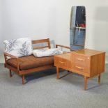 A 1970's drop arm two seater sofa, together with a 1970's dressing table,