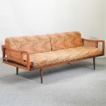 A 1960's teak sofa, with loose cushions,