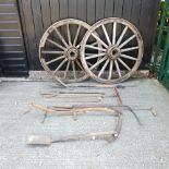 A pair of antique wooden cartwheels, each 120cm diameter,