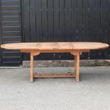 A teak extending garden table,