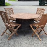 A teak circular garden table, 120cm diameter,