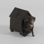 A Vienna style bronze model of a dog, in a kennel,
