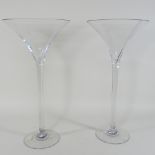 A pair of large cocktail glasses,