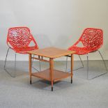 A pair of modern red plastic and chrome chairs, together with a teak occasional table,