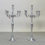A pair of plated table candelabra,