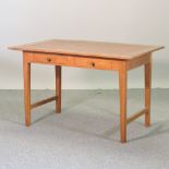 A teak writing table, containing two drawers,