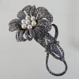 A marcasite and pearl floral brooch