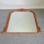 A large pine framed over mantel mirror,