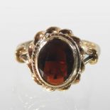 A 9 carat gold garnet ring,