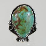 A silver and turquoise ring,
