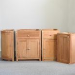 A free standing oak kitchen unit, 70cm, together with a single door cabinet,