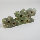 A jade coloured hardstone brush rest,