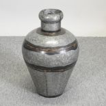 A large metal water pot,