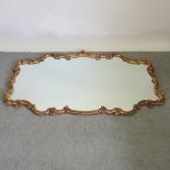 A large ornate gilt framed wall mirror,