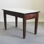 An antique pine work table, with an enamelled top,