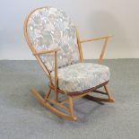 An Ercol light elm rocking chair,