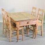 An antique pitch pine dining table, with a single drawer, 114 x 86cm,