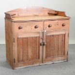 An antique pine dresser base, with a gallery back,
