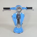 A table lamp, in the shape of a blue scooter,