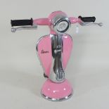 A table lamp, in the form of a pink scooter,