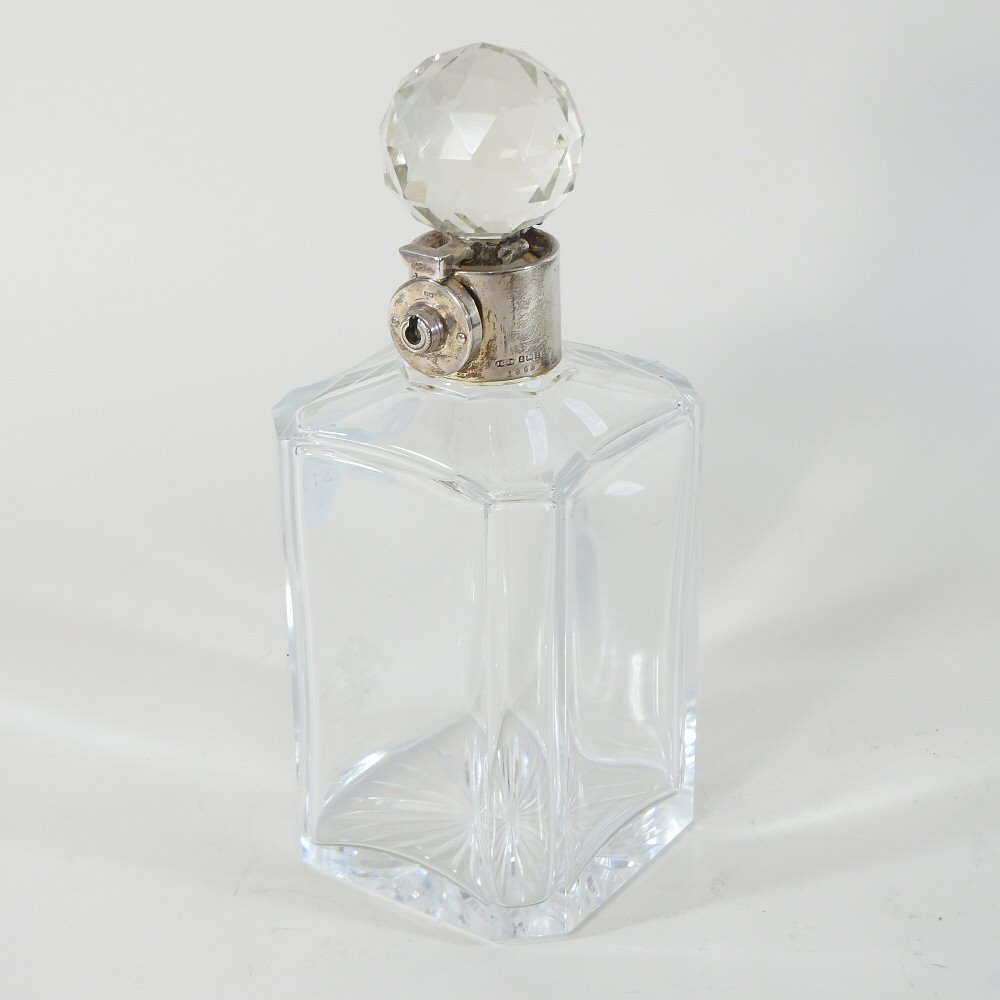 An early 20th century silver mounted glass decanter and stopper, with a lockable silver collar, - Image 4 of 7