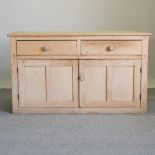 An antique pine dresser base,