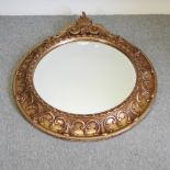A large circular gilt framed wall mirror,