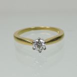 An 18 carat gold solitaire diamond ring, approximately 0.