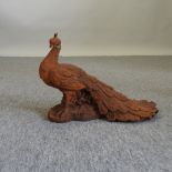 A metal model of a peacock,