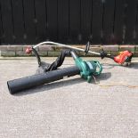 A Homelite petrol strimmer,