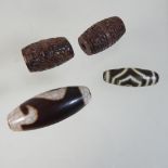 A collection of four reproduction Chinese agate beads