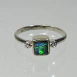 An 18 carat gold opal and diamond ring