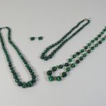 A malachite graduated single strand bead necklace.