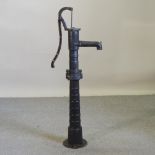 A black painted cast iron water pump,