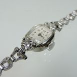 A mid 20th century 14 carat gold cased Elgin ladies diamond set cocktail watch,