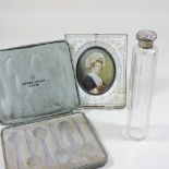 An early 20th century silver mounted glass toiletry bottle,