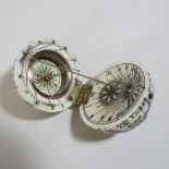 A reproduction bone effect miniature globe compass,