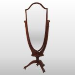 An Edwardian mahogany and inlaid cheval mirror, having an adjustable shield shaped plate,
