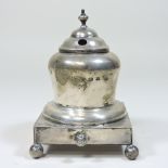 An early 20th century silver inkwell, of circular form, on a plinth base, Birmingham, marks rubbed,