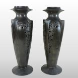 A pair of Geschutzt Art Deco pewter vases, of slender tapered shape,
