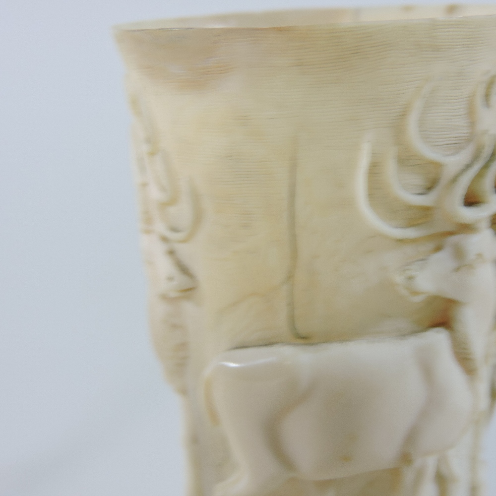 A 19th century German carved and turned ivory hunting cup, of slender form, - Image 2 of 9