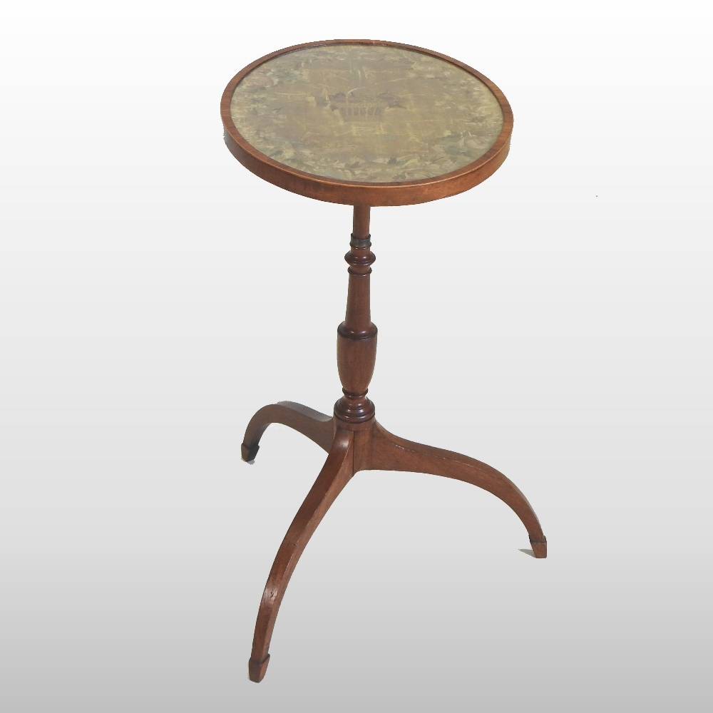 A Victorian mahogany occasional table, with a circular inset tapestry top, on a tripod base,