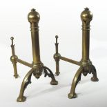 A pair of 19th century Gothic revival brass andirons, in the manner of Pugin, with turned uprights,