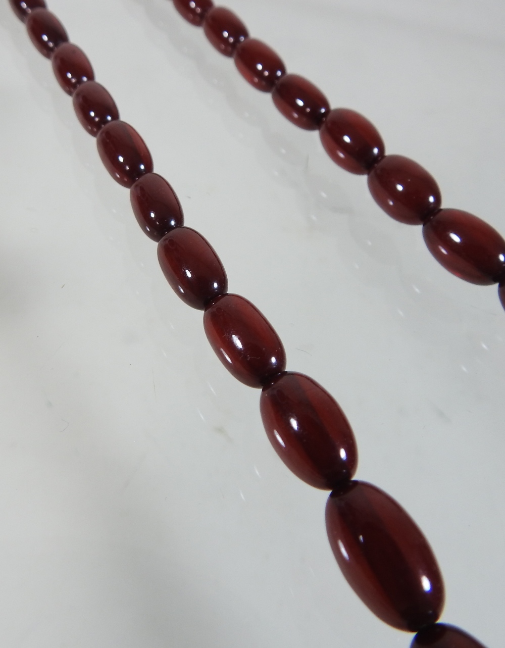 A cherry amber bead necklace, - Image 5 of 8