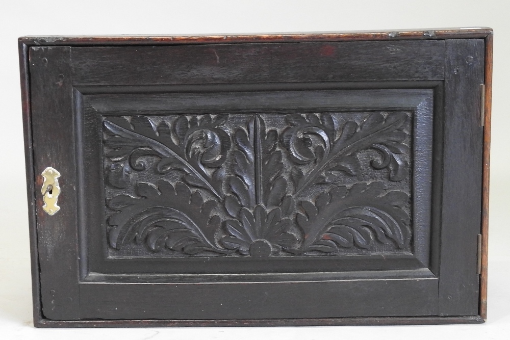 An 18th century carved oak spice cabinet, fitted with an arrangement of twelve short drawers, - Image 8 of 8