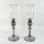 A pair of 19th century silver plated table lamps, each with a knopped stem and gadrooned decoration,