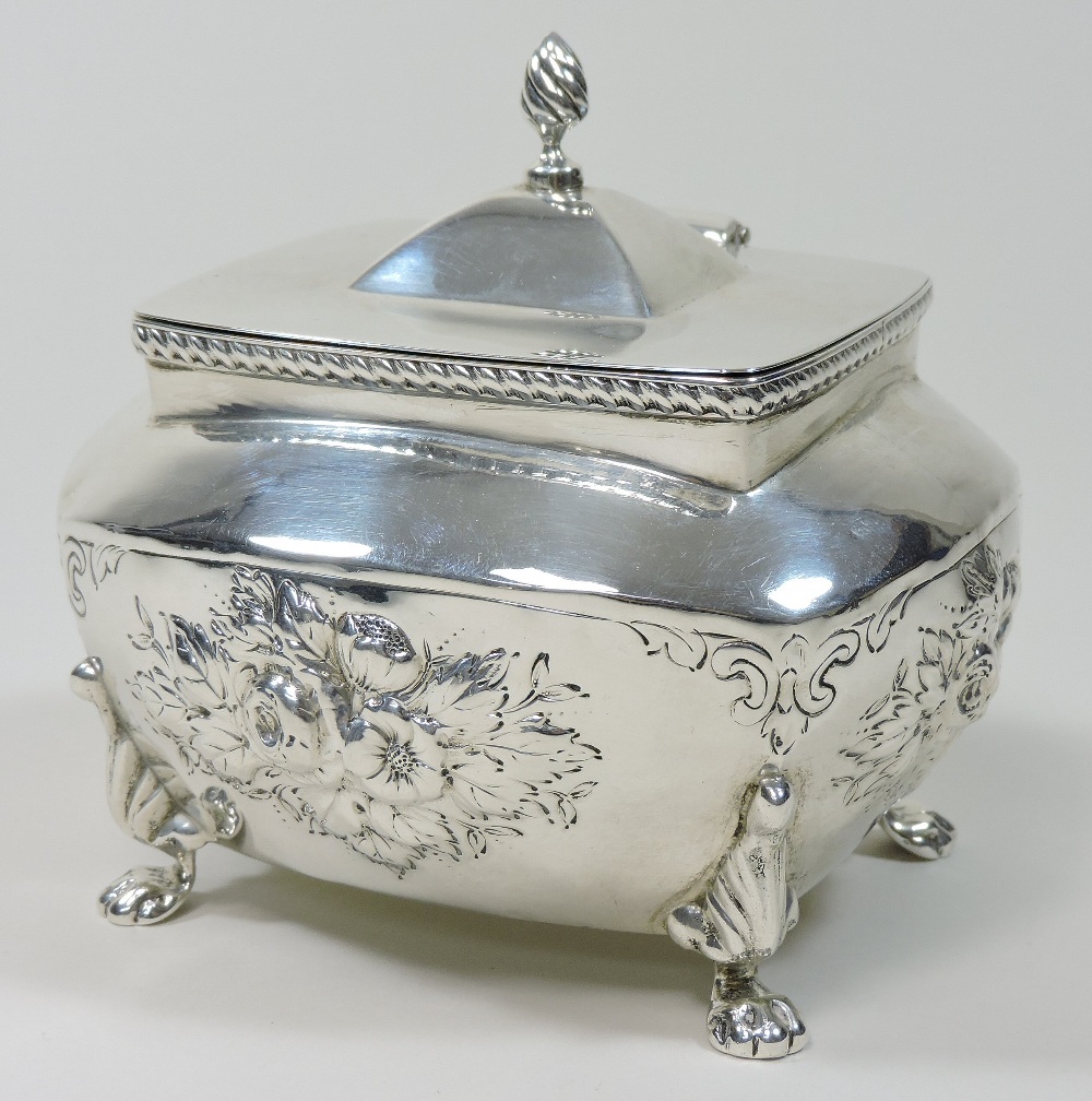 An early 20th century silver tea caddy, relief decorated with flowers, on paw feet, - Image 4 of 9