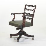 A 19th century Chippendale style swivel desk chair