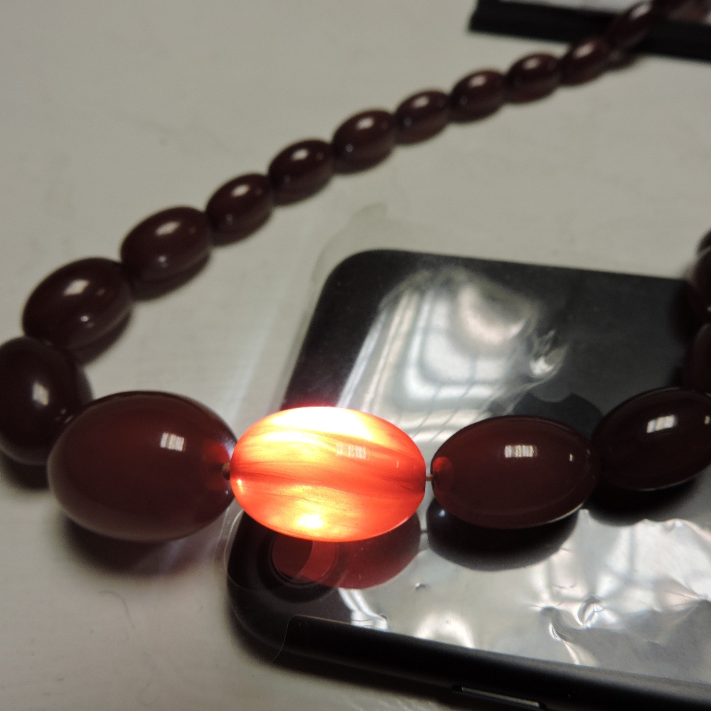 A cherry amber bead necklace, - Image 8 of 8